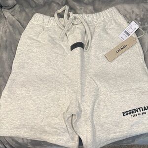 NWT, brand new Fear of God Essentials light oatmeal xs shorts